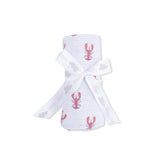 White baby blanket with red lobster design and white bow on a white background