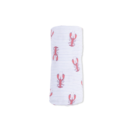 White swaddle blanket with red lobster pattern on a white background