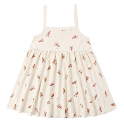 White dress with red lobster pattern on a white background