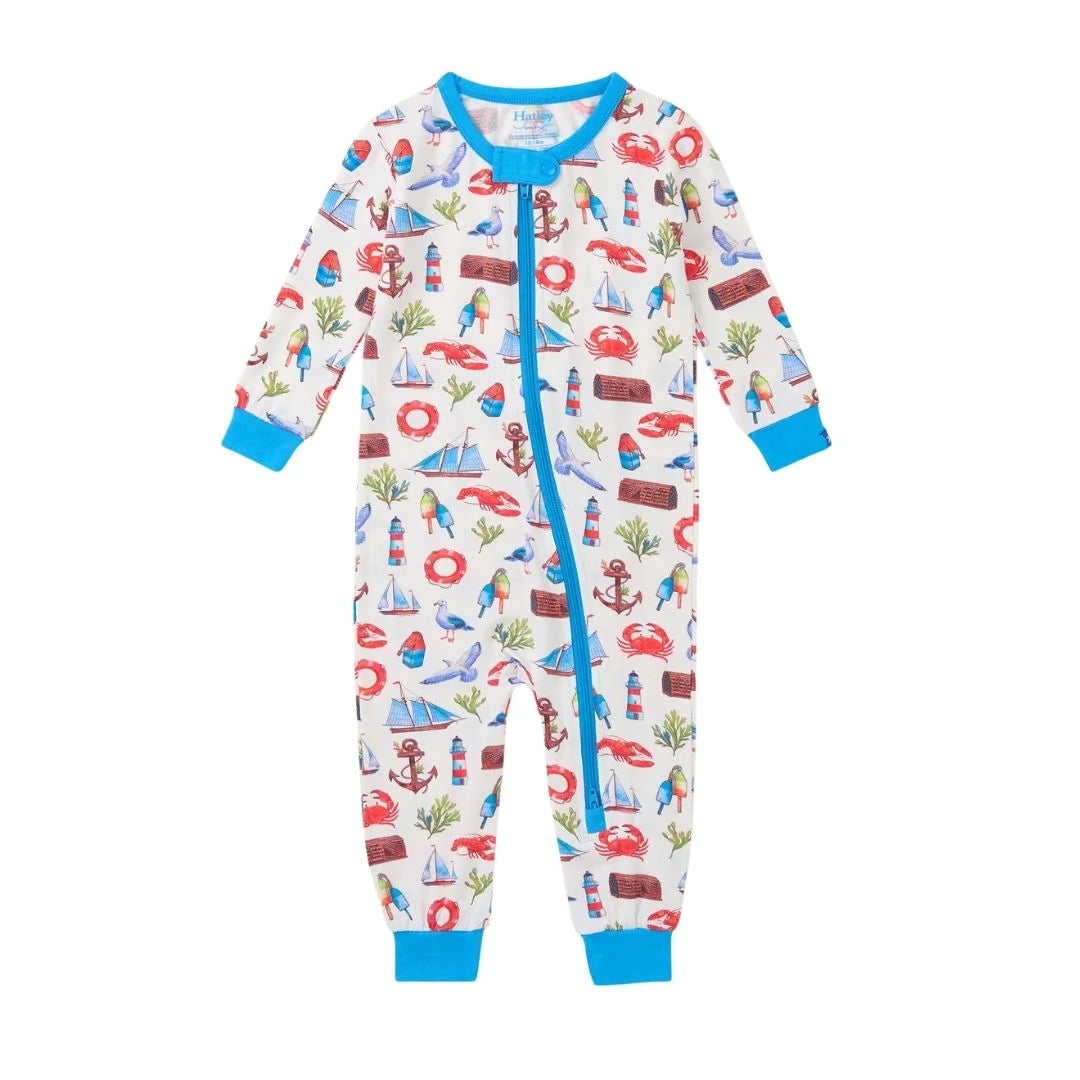 coverall featuring nautical emblems all over, base is white with blue trim