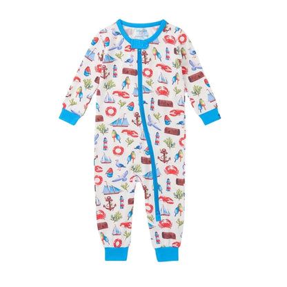 coverall featuring nautical emblems all over, base is white with blue trim