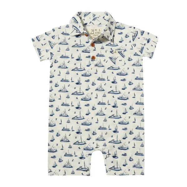 white romper with navy boats all over