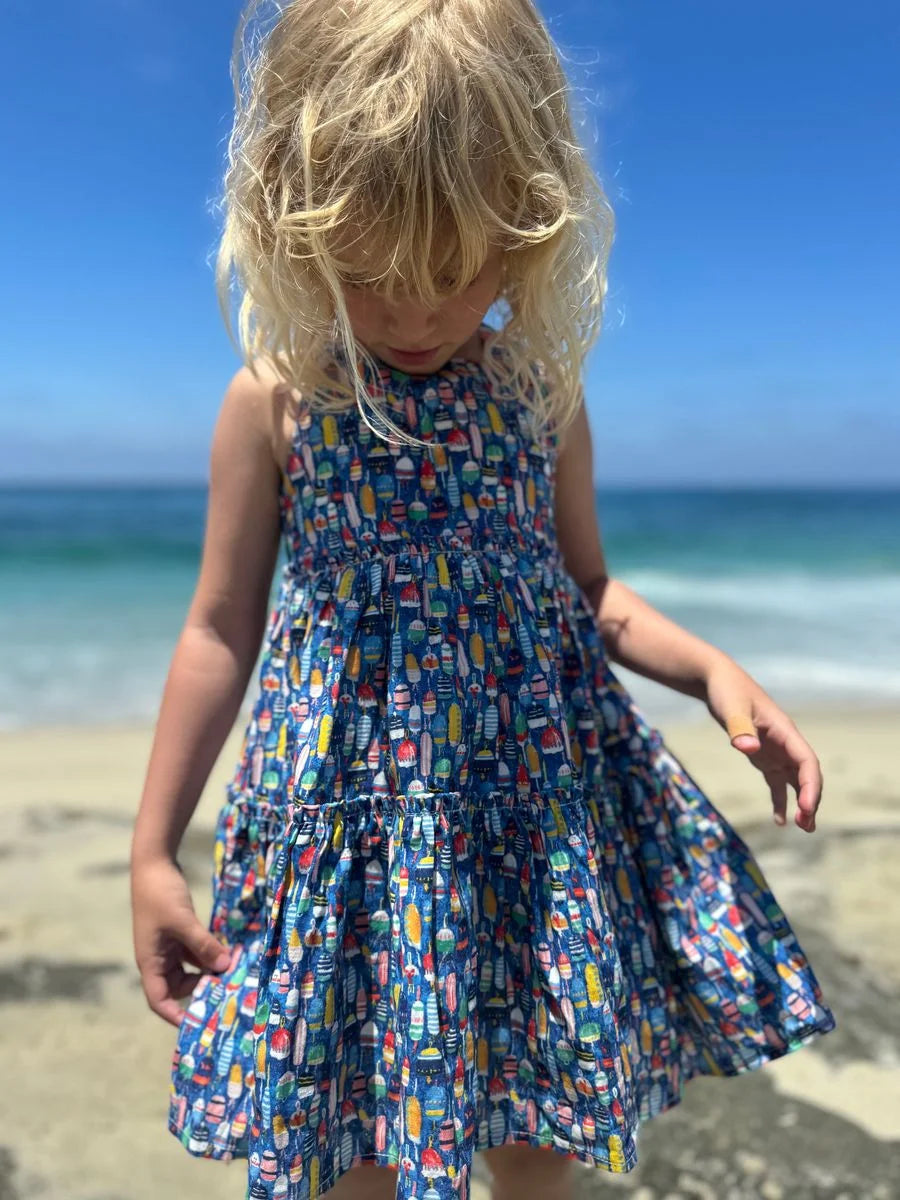 girl wearing buoy dress on the beach