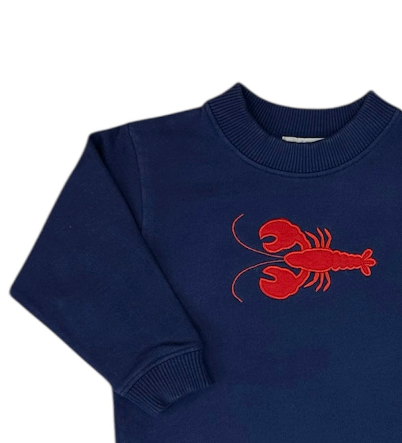 Navy blue sweater with a red lobster design on a white background