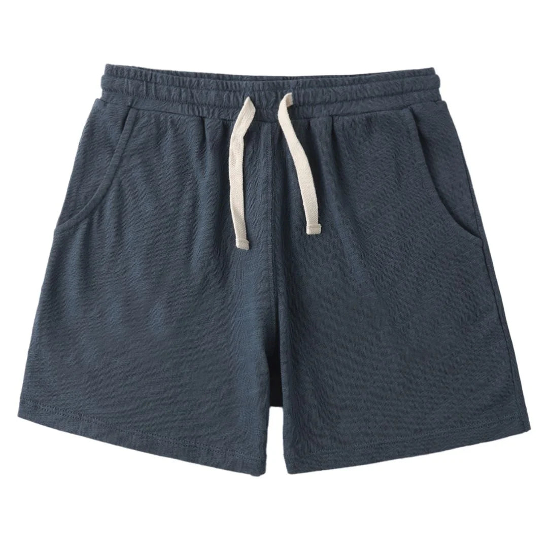 Blue shorts with a drawstring on a white background