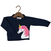 A navy blue ribbed knit baby sweater with a knitted unicorn design on the front, featuring a pink and white body with a yellow horn, displayed on a wooden hanger against a white background.