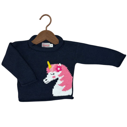 A navy blue ribbed knit baby sweater with a knitted unicorn design on the front, featuring a pink and white body with a yellow horn, displayed on a wooden hanger against a white background.