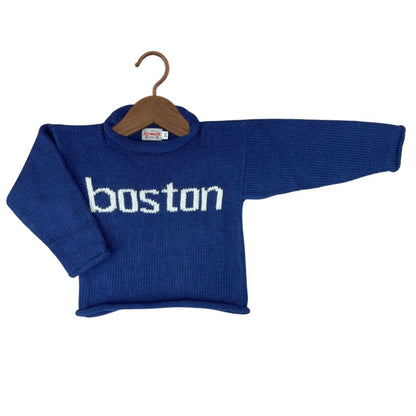 A royal blue knit baby sweater with &