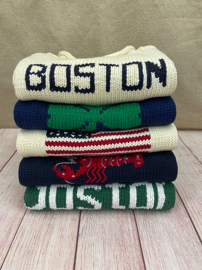 stack of new england sweaters