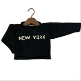 A black knit sweater with &