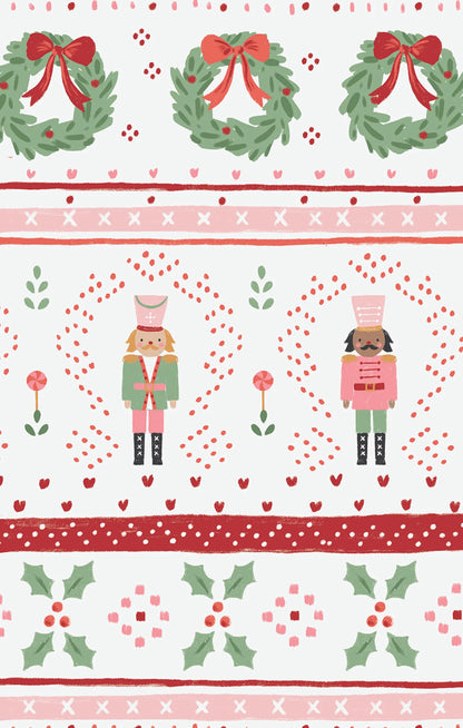 Christmas-themed fabric pattern with wreaths, nutcrackers, and holly leaves on a white background.