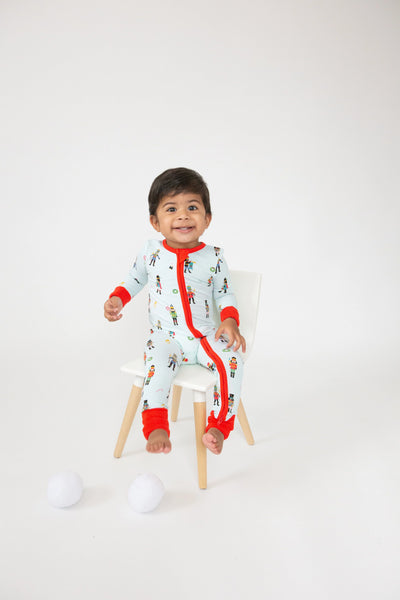 blue romper with nutcrackers and red cuffs