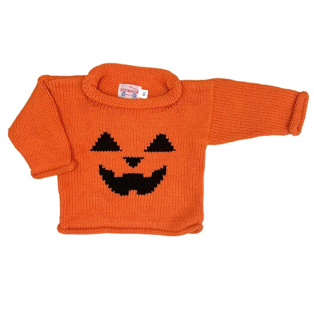 bright orange long sleeve sweater with black jack o lantern face features