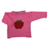 pink long sleeve sweater with red apple in center