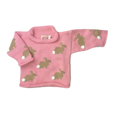 long sleeve pink sweater with tan bunnies all over, each bunny has a white pom pom tail