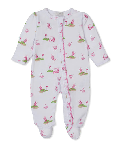 white and pink footie with golf emblems all over and ruffle all down the zipper