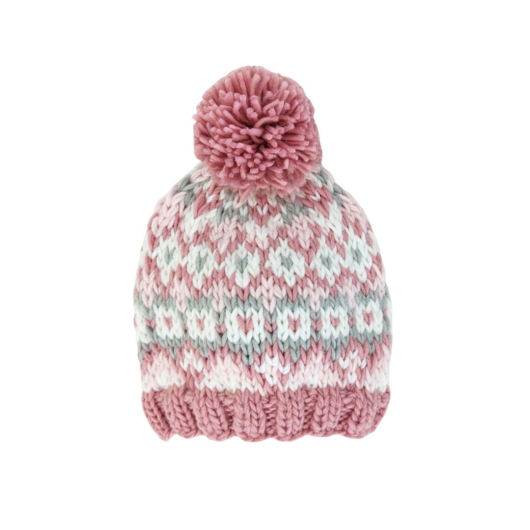Knitted hat with a pink pom-pom on a white background