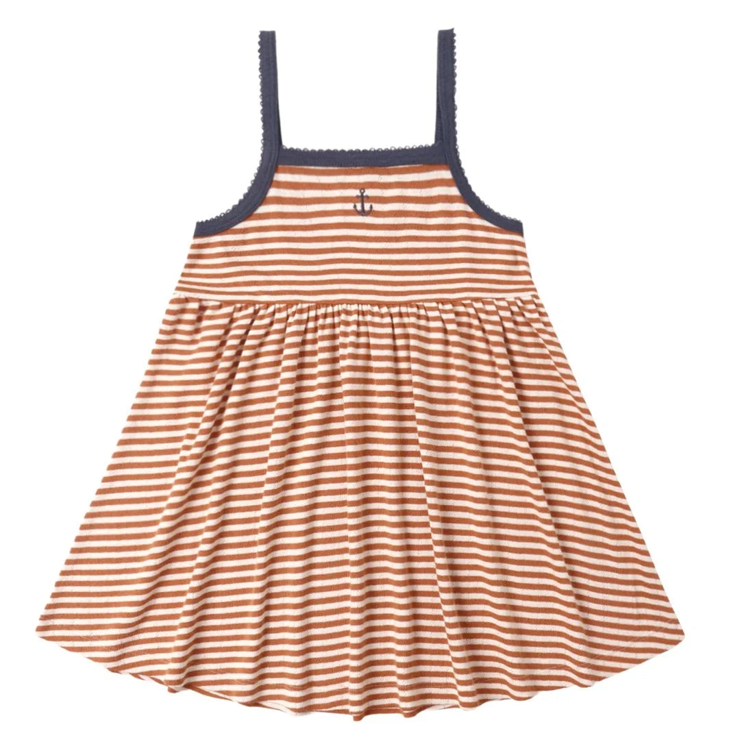 Striped dress with anchor detail on a white background