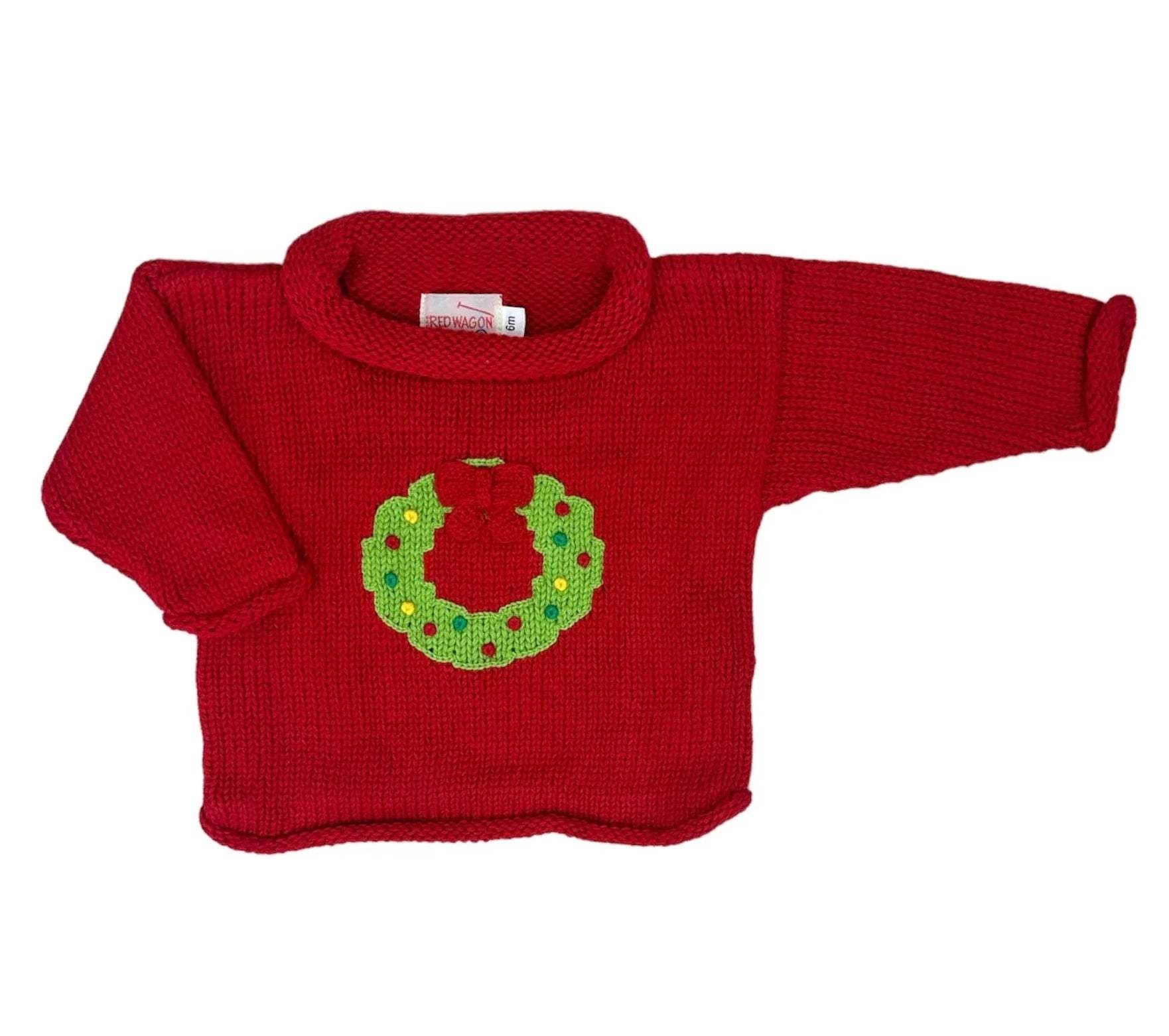 red sweater with green christmas wreath