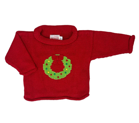 red sweater with green christmas wreath
