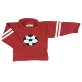 red roll neck sweater with 2 white stripes on each sleeve and black and white soccer ball in center