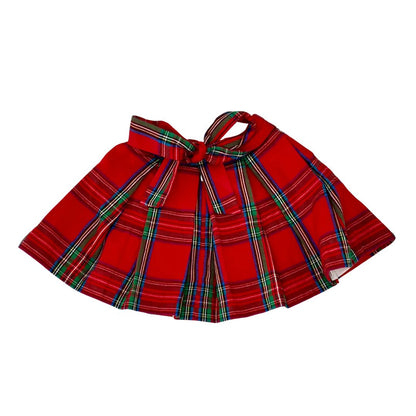Red plaid skirt with a bow on a white background