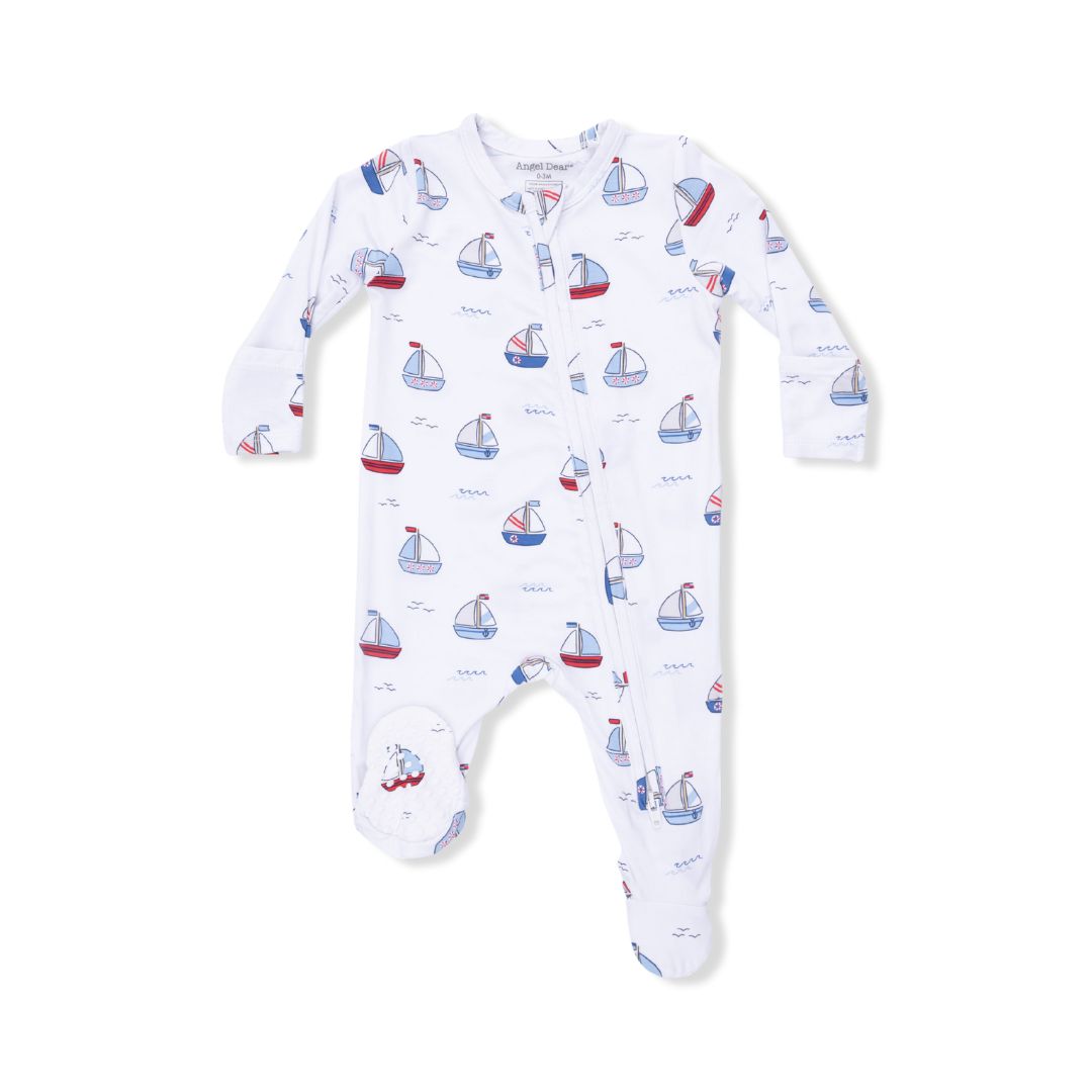 Baby onesie with sailboat pattern on a white background