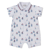 Baby romper with sailboat pattern on a white background