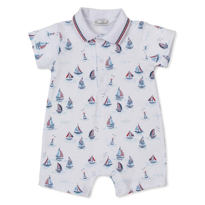 Baby romper with sailboat pattern on a white background