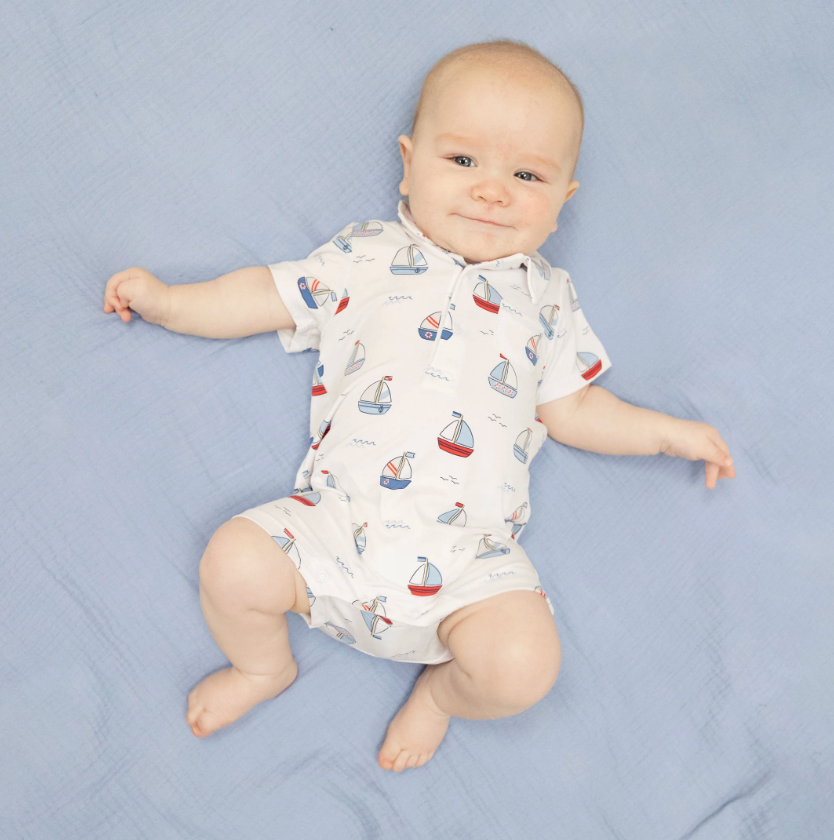 baby wearing sailboat romper