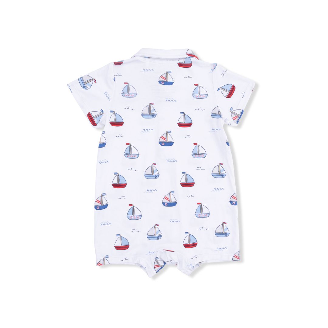 Baby romper with sailboat pattern on a white background