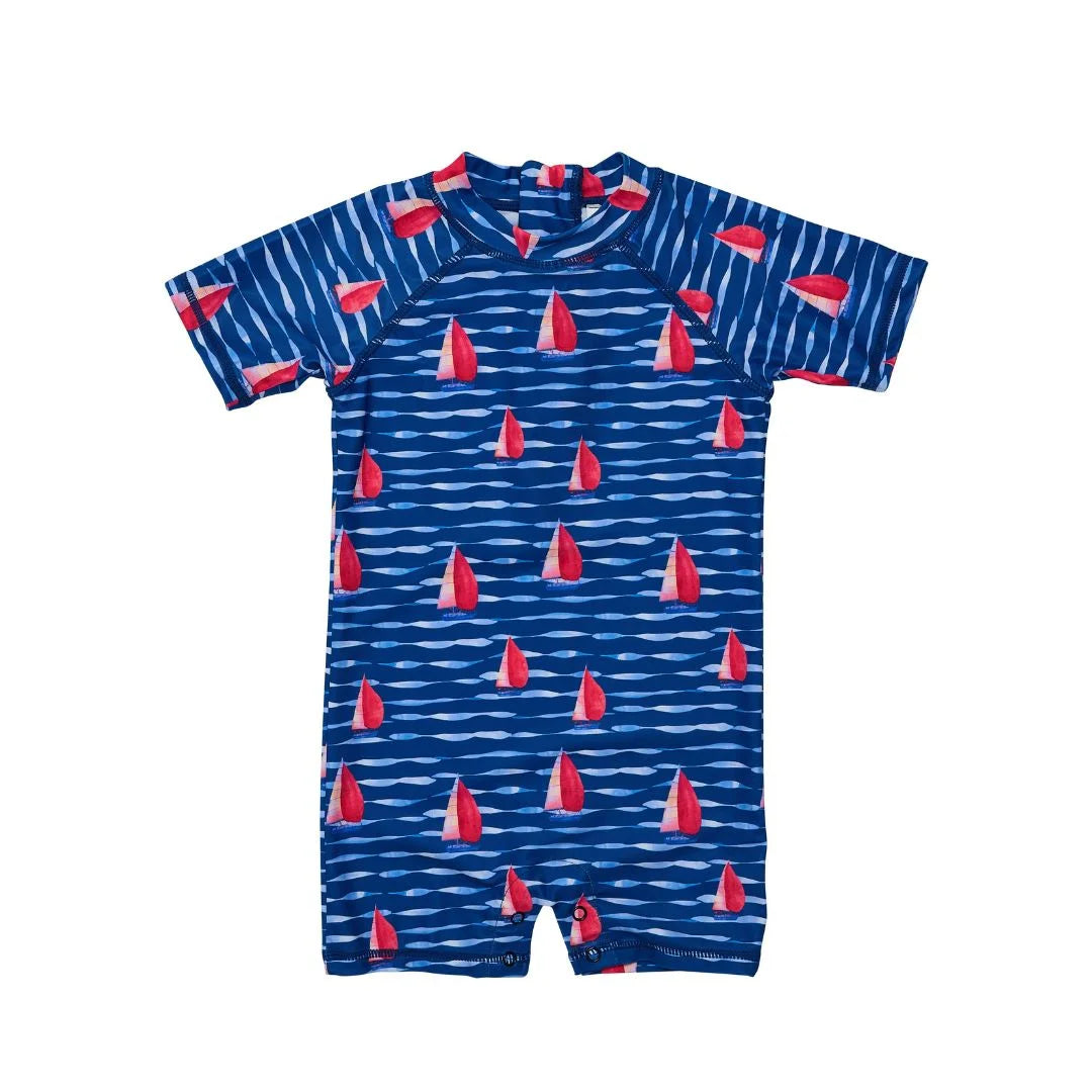 navy and red baby swimsuit with sailboat design