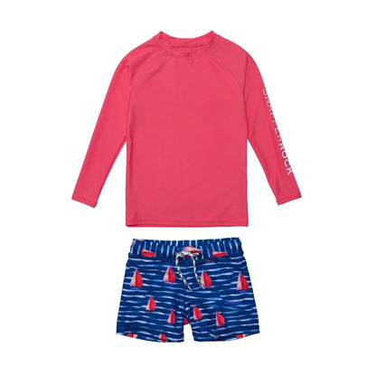 red top with navy swim shorts with sailboats all over