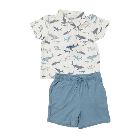 sharks polo shirt and blue shorts