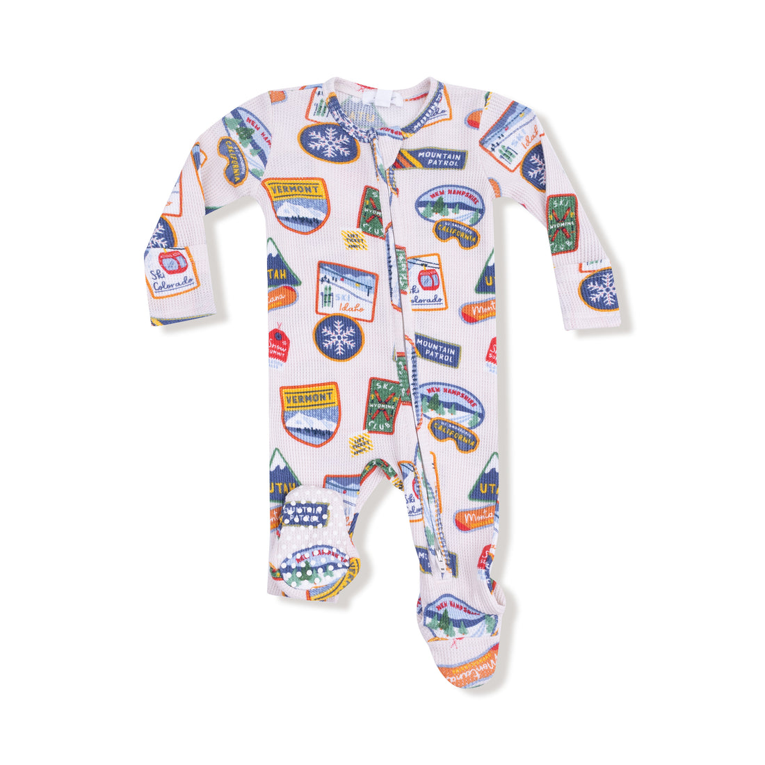 Baby onesie with colorful patches on a white background