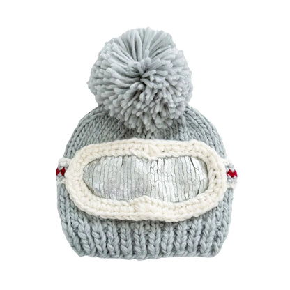 Gray knit beanie with a pom-pom and goggles on a white background