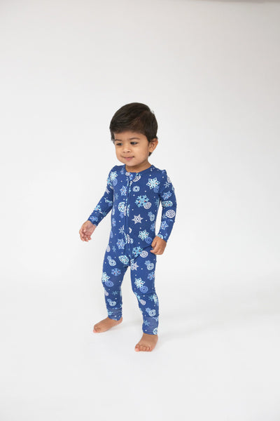 dark blue romper with snowflakes all over