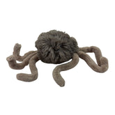 Plush spider toy on a white background