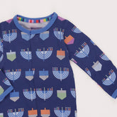 blue footie with menorahs all over