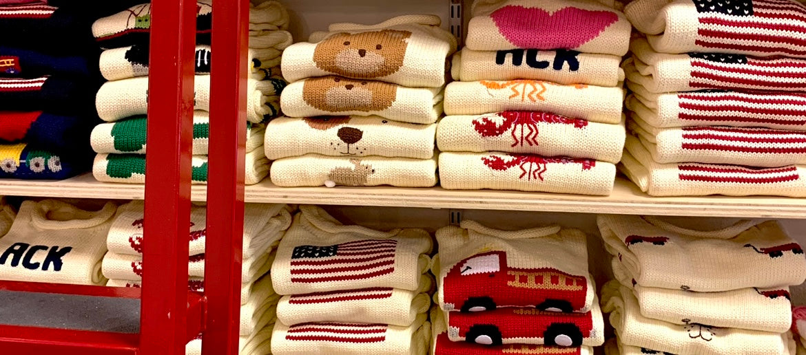 shows different sweaters folded on shelves