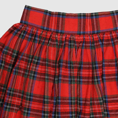 Red plaid skirt with a white background