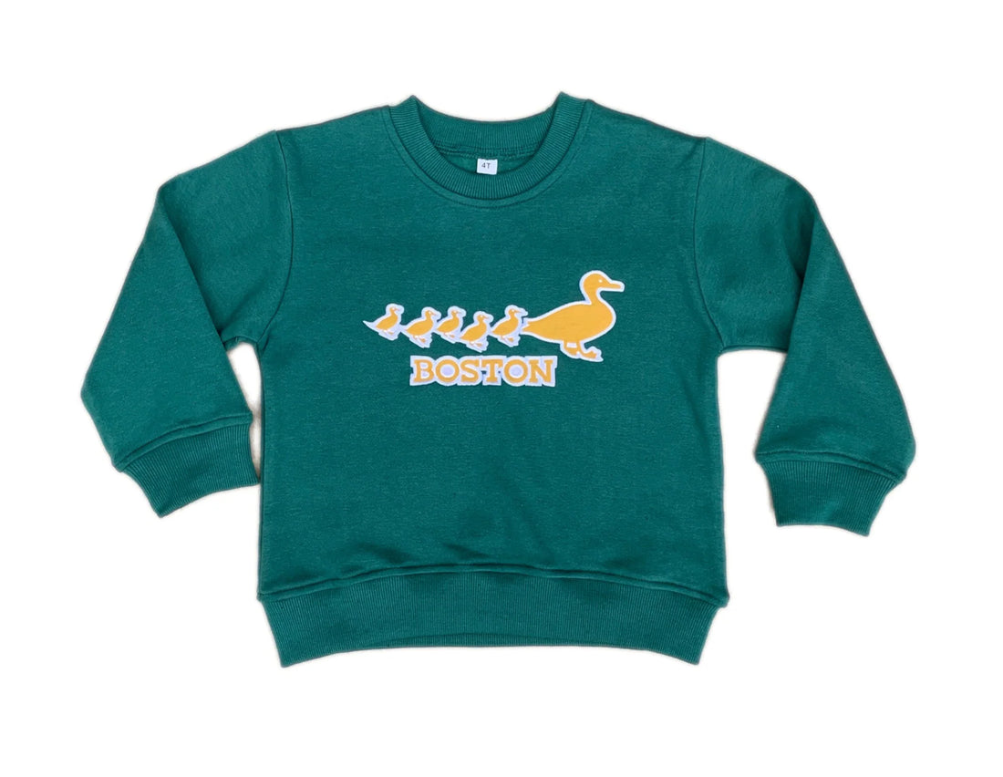Green sweatshirt with a graphic design on a white background