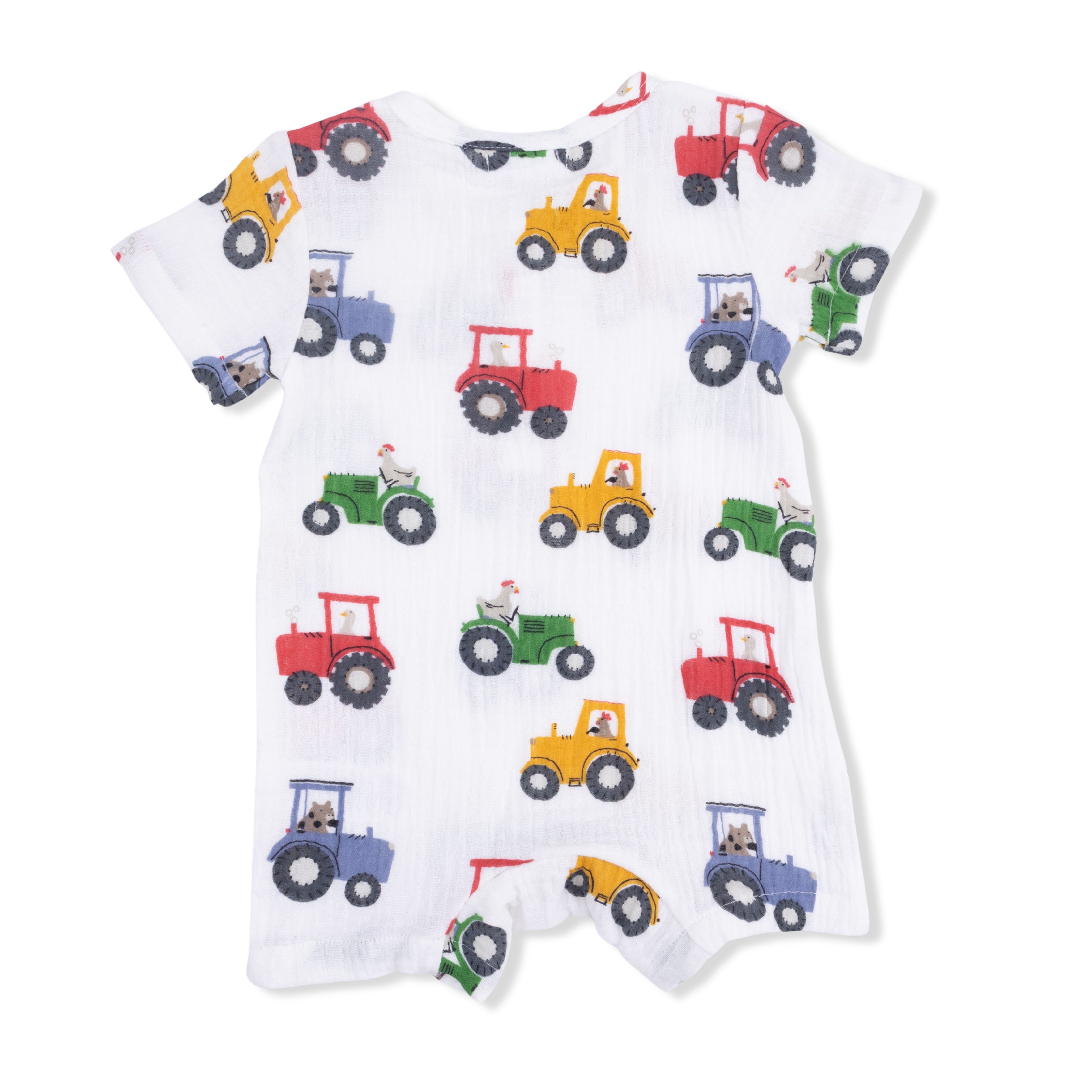White baby romper with colorful tractor pattern on a white background