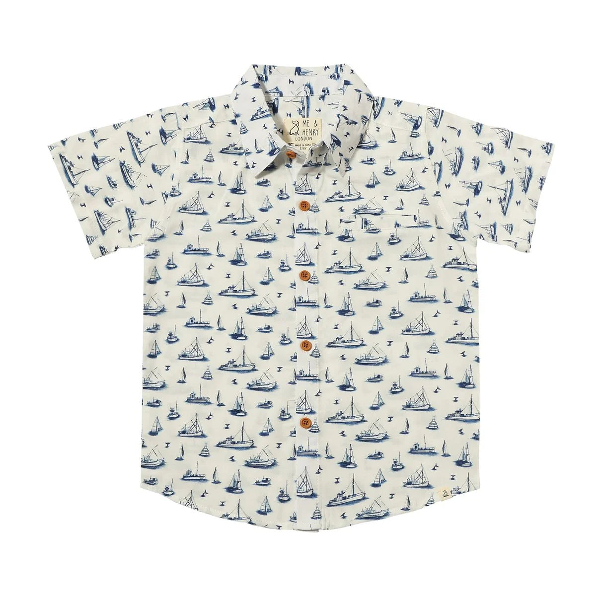 ivory shirt with blue sailboats all over