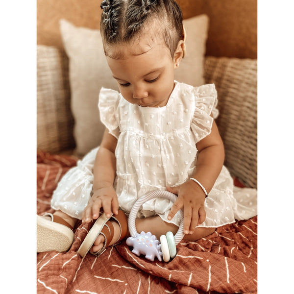 baby with rattle