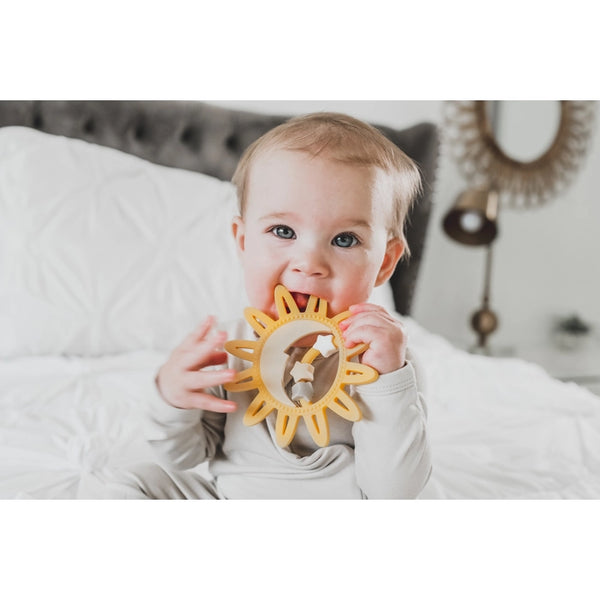 baby chewing on teether