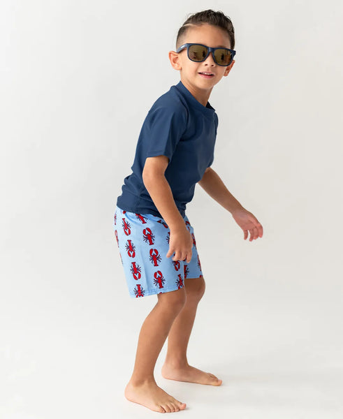 boy wearing swim trunks