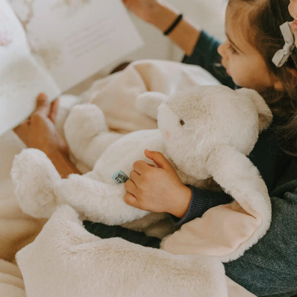 little girl with bunny plush