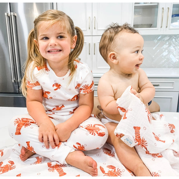 girl and baby - girl is wearing pajamas