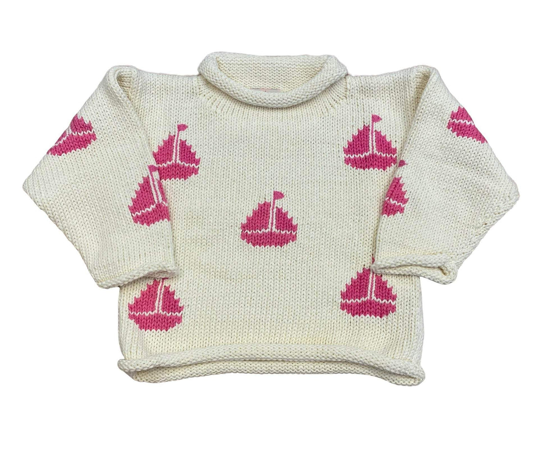 ivory roll neck sweater with pink sailboats knitted all over